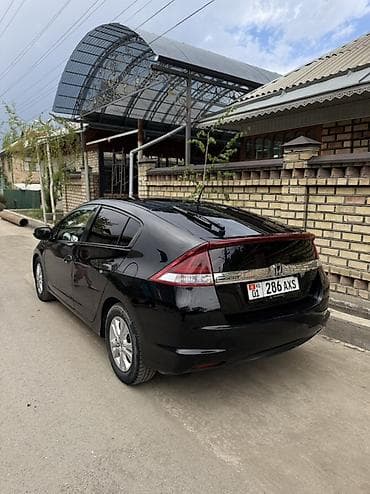 хонда инсайт гибрид: Honda Insight: 2012 г., 1.3 л, Вариатор, Гибрид, Хэтчбэк — 2