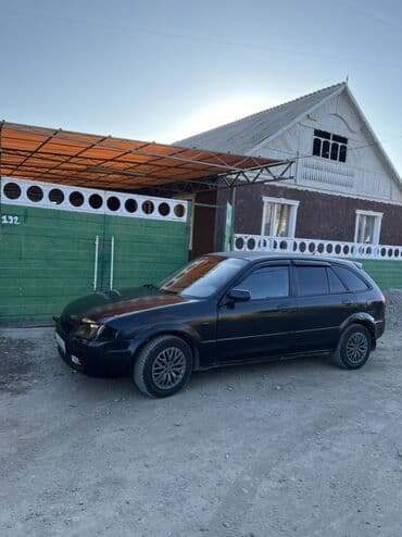 Паркет: Mazda 323: 1999 г., 1.5 л, Механика, Бензин, Хэтчбэк — 1