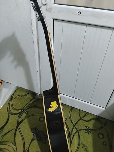 детский баян: Акустическая гитара с вырезом (cutaway), черный глянец. - Корпус — 4