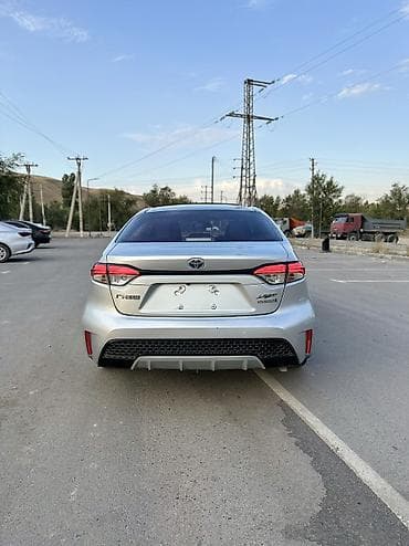 byd e2 2023: Toyota Corolla: 2021 г., 1.8 л, Автомат, Гибрид, Седан — 2
