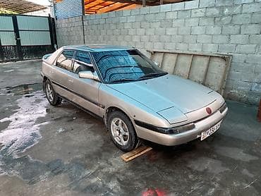 Mazda 323: 1991 г., 1.8 л, Механика, Бензин, Лифтбек — 3
