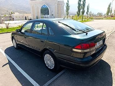 7 00 r16: Mazda 626: 1997 г., 1.8 л, Механика, Бензин, Седан — 7
