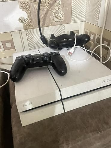 Sony PlayStation 4 (белая версия) Комплектация: - Игровая консоль PS4