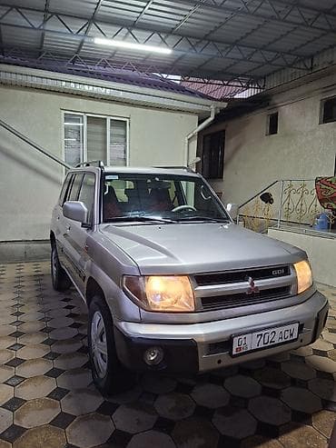 горный: Mitsubishi Pajero iO: 2001 г., 2 л, Автомат, Бензин, Внедорожник — 1