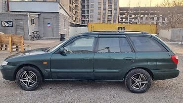 Транспорт: Mazda Capella: 2000 г., 2 л, Механика, Бензин, Универсал — 3