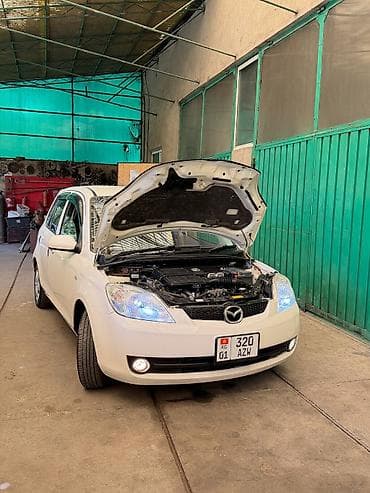 айни 95: Mazda Demio: 2005 г., 1.5 л, Автомат, Бензин — 1