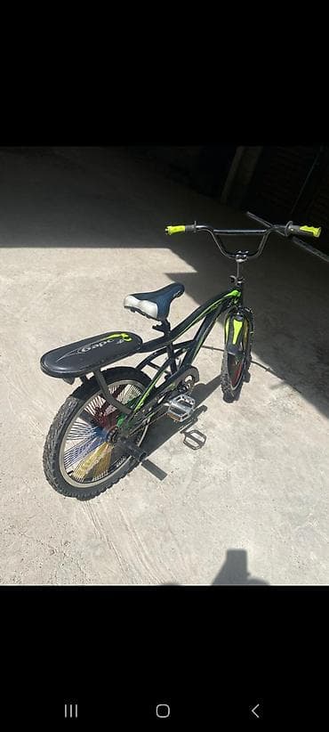 format velosiped: Универсальный велосипед черного цвета с яркими салатовыми акцентами — 2