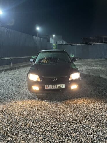 mini cooper: Mazda 323: 2002 г., 1.6 л, Механика, Бензин, Хэтчбэк — 10