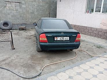 mazda d: Mazda 323: 2001 г., 1.6 л, Механика, Бензин, Седан — 4