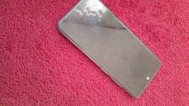 сенсорный телефон: Смартфон Redmi в светло-голубом/серебристом цвете. Устройство имеет — 2