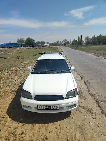 r16 215 65: Белый универсал с рейлингами на крыше. Компактный кузов, пять дверей — 8