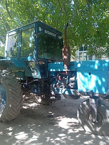 навеска т 150: Трактор колесный, голубой, с кабиной и вертикальным выхлопом. На — 2