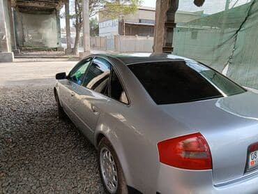 домкрат на ауди: Автомобиль Audi A6 серебристого цвета, представленный в кузове седан — 5