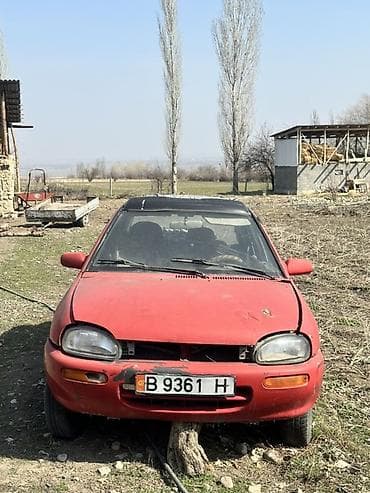 e 303: Mazda 121: 1993 г., 1.3 л, Механика, Бензин, Хэтчбэк — 1