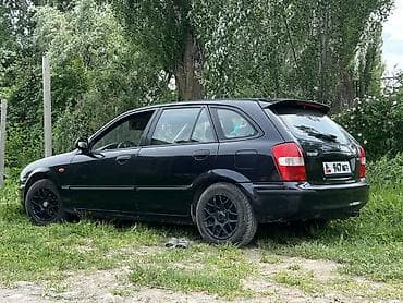 Унаа сатуу: Mazda 323: 1999 г., 1.5 л, Кол менен иштөөчү, Бензин, Хетчбек — 4