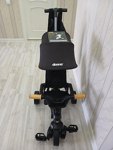 Детский трёхколёсный велосипед-коляска Doona Liki Trike S5 (черный) - — 1