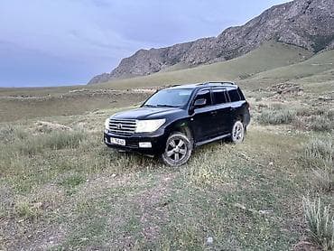 таета аллион: Toyota Land Cruiser 200, черный кузов, внедорожник 5‑дверный — 1