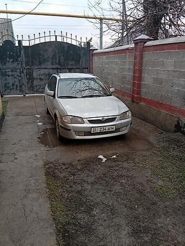 x5 e53: Mazda 323: 2000 г., 1.5 л, Механика, Бензин, Универсал — 1