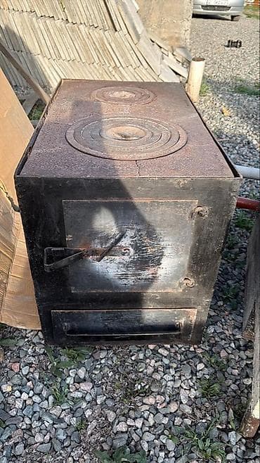 отопительные катлы: Дровяная печь-плита из металла с варочной поверхностью. - — 1