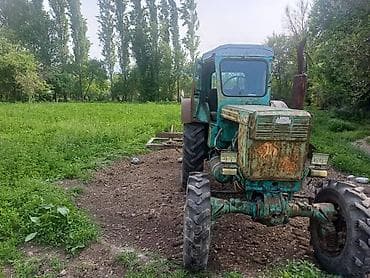 Трактор Т-40 с навесным оборудованием Описание: - Колесный трактор