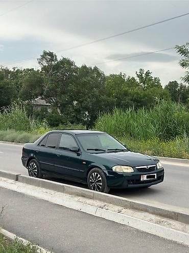 Mazda 323: 2000 г., 1.3 л, Механика, Бензин, Седан