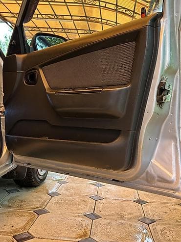 7 мест 3 ряда сидений: Daewoo Gentra / Chevrolet Lacetti — салон и оснащение - Руль с — 5