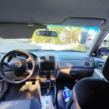 бутка бу: Mazda Familia: 2002 г., 1.6 л, Автомат, Бензин, Седан — 9