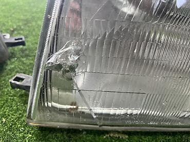 грузовики ош: Левая передняя фара Тойота Ленд круизер 105 (до рест) Оригинал — 2