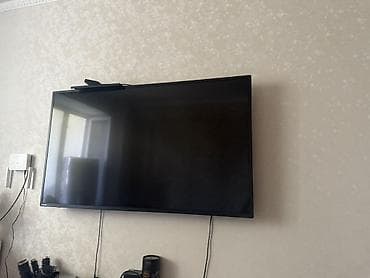 тела: Телевизор LED, диагональ примерно 49–55". Плоская панель с тонкими — 1
