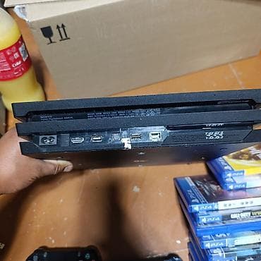 мото зарядка: PlayStation 4 Pro (черная) + 2 геймпада DualShock 4 + набор дисков ИЛИ — 5