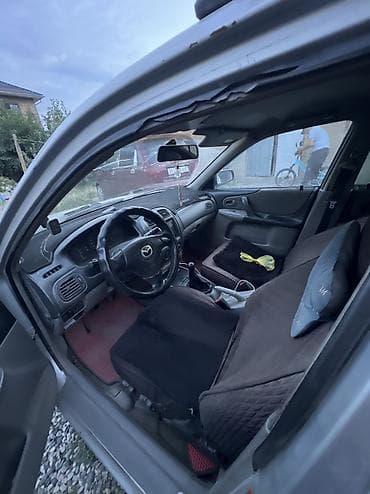 chek it: Mazda 323: 2005 г., 1.6 л, Механика, Седан — 2