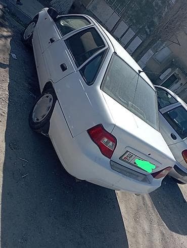 Седан белого цвета. Основные характеристики: - Кузов: 4‑дверный at lalafo.kg Седан белого цвета. Основные характеристики: - Кузов: 4‑дверный