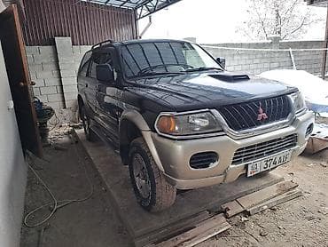 боковой: Mitsubishi Pajero Sport: 2002 г., 2.5 л, Механика, Дизель, Внедорожник — 6