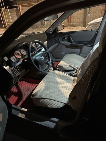 Транспорт: Mazda Familia: 2002 г., 1.6 л, Механика, Бензин, Универсал — 6