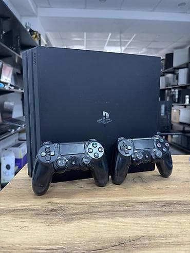 controller ps3 original: Игровая приставка Sony PlayStation 4 Pro (черная) с двумя — 1