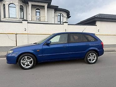 Унаа: Mazda 323: 2003 г., 1.6 л, Кол менен иштөөчү, Бензин, Хетчбек — 2