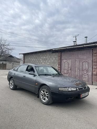 вампер 124: Mazda 626: 1995 г., 2 л, Ручные, Бензин, Седан — 4
