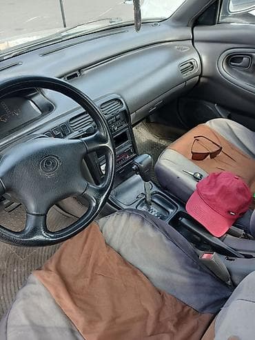 demio бампер: Mazda Cronos: 1993 г., 2 л, Автомат, Бензин, Седан — 8