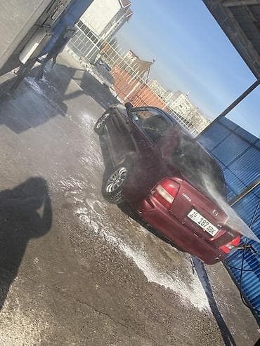 миленим: Mazda Familia: 1998 г., Бензин, Седан — 3