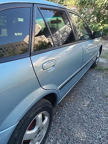 mazda 121: Mazda Familia: 2002 г., 1.5 л, Автомат, Бензин, Универсал — 3