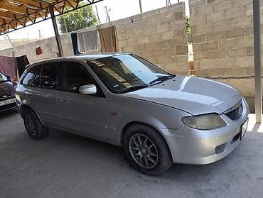 люк 124: Mazda 323: 2003 г., Хэтчбэк — 3