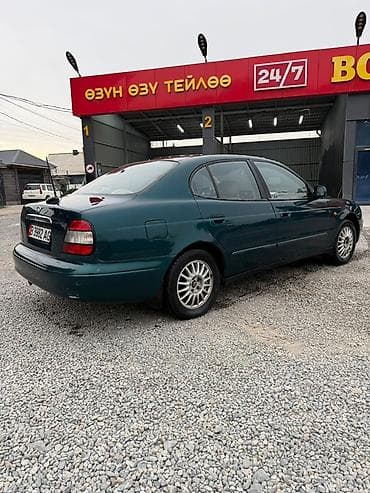касем машина: Daewoo Leganza: 2000 г., 2 л, Автомат, Бензин, Седан — 5