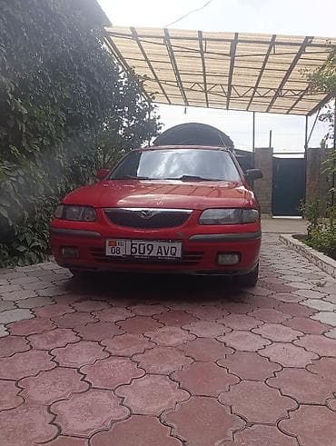 бампер на демио: Mazda 626: 1998 г., 2 л, Механика, Бензин, Лифтбек — 4