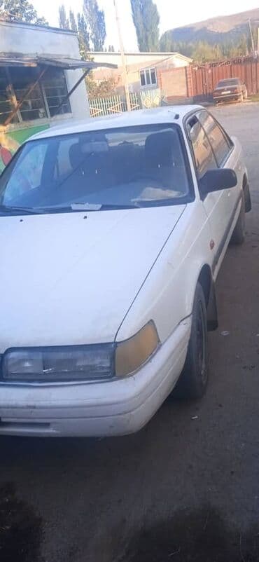 купить запчасти на опель вектра б: Mazda 626: 1990 г., Механика, Седан — 3