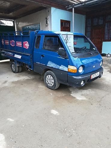 купить santa fe: Hyundai Porter — компактный бортовой грузовик синего цвета. Основные — 1