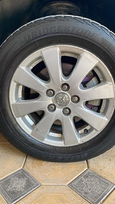 Унаа: Оригинальные колёсные диски Toyota с зимними шинами Bridgestone — 4