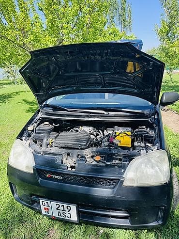 100 с4: Daihatsu Cuore: 2004 г., 1 л, Ручные, Бензин, Хэтчбэк — 5