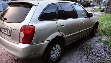 Транспорт: Mazda 323: 2003 г., 1.6 л, Кол менен иштөөчү, Бензин, Хетчбек — 6