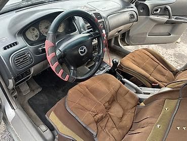 golf variant: Mazda 323: 2002 г., 1.6 л, Механика, Бензин, Седан — 8