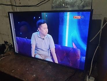 Телевизор VISION (диагональ примерно 32–40") с LED‑подсветкой. -